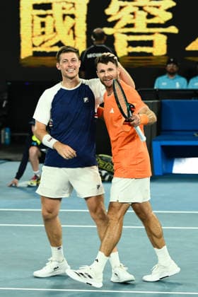 TENNIS AUSTRALIAN OPEN, Christian Harrison (orange) of the USA and Neal Skupski (blue) of Great Britian celebrate after winning the men™s doubles final against Jason Kubler (pink) and Marc Polmans (red) of Australia on day 14 of the 2026 Australian Open tennis tournament at Melbourne Park in Melbourne, Saturday, January 31, 2026. ( NO ARCHIVING MELBOURNE VICTORIA AUSTRALIA  Copyright: xJOELxCARRETTx 20260131140344946523