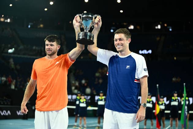 TENNIS AUSTRALIAN OPEN, Christian Harrison (orange) of the USA and Neal Skupski (blue) of Great Britian pose with the winners trophy after winning the men™s doubles final against Jason Kubler (pink) and Marc Polmans (red) of Australia on day 14 of the 2026 Australian Open tennis tournament at Melbourne Park in Melbourne, Saturday, January 31, 2026. ( NO ARCHIVING MELBOURNE VICTORIA AUSTRALIA  Copyright: xJOELxCARRETTx 20260131175093700604