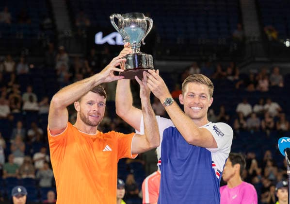(260131) -- MELBOURNE, Jan. 31, 2026 -- Christian Harrison (L) Neal Skupski hold the trophy during the awarding ceremony for the men s doubles final match between Jason Kubler Marc Polmans (Australia) and Christian Harrison (the United States) Neal Skupski (Britain) at the Australian Open tennis tournament in Melbourne, Australia, Jan. 31, 2026. (Photo by Xinhua) (SP)AUSTRALIA-MELBOURNE-TENNIS-AUSTRALIAN OPEN-MEN S DOUBLES-FINAL HuxJingchen 