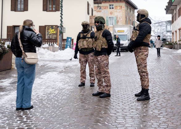 January 30, 2026, Cortina D ampezzo, Belluno, Italy: Specialized forces engage with a woman in the Cortina dÃ¢â‚¬â ¢Ampezzo village Friday, Jan 30th. AI says N.O.S. badges scene on the arms of these men may mean in Italian military or law enforcement context, N.O.S. often refers to the Nucleo Operativo Centrale di Sicurezza (NOCS), which is the elite counter-terrorism police tactical unit of the Polizia di Stato. It may also refer to the NATO Office of Security (NOS). With only a few days until the start of the 2026 Milano Cortina Winter Olympics a buzz of frantic last minute construction and enhanced security is noticeable in the venues and village of Cortina dÃ¢â‚¬â ¢Ampezzo Thursday, January 30, 2026. Cortina D ampezzo Italy - ZUMAa35_ 20260130_oly_a35_001 Copyright: xDanxAndersonx