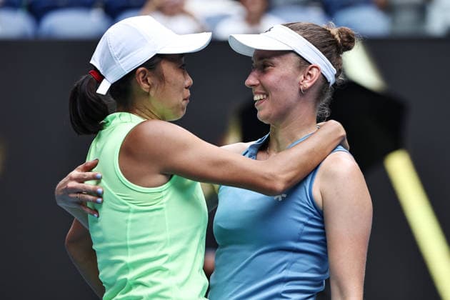 Zhang Shuai (yellow), CHN, and Elise Mertens (blue), BEL, during womens doubles finals at 2026 Australian Open in Melbourne, 31 01 2026; -