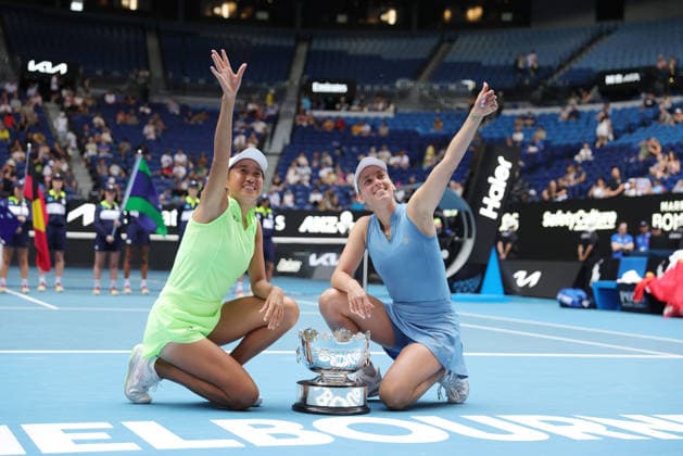 Zhang Shuai (yellow), CHN, and Elise Mertens (blue), BEL, after womens doubles finals at 2026 Australian Open in Melbourne, 31 01 2026; -