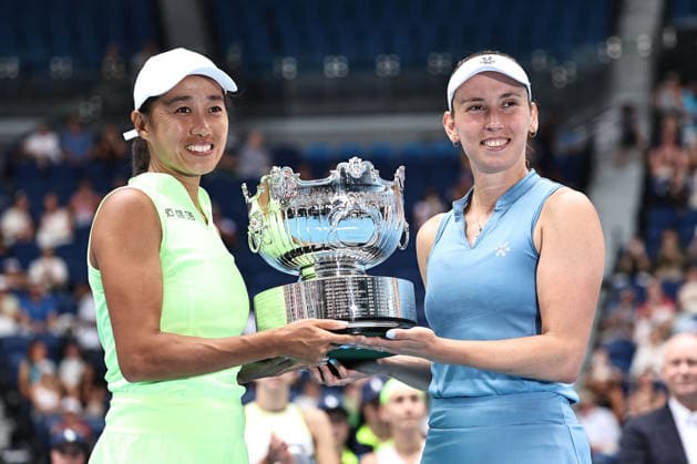 Zhang Shuai (yellow), CHN, and Elise Mertens (blue), BEL, after womens doubles finals at 2026 Australian Open in Melbourne, 31 01 2026; -