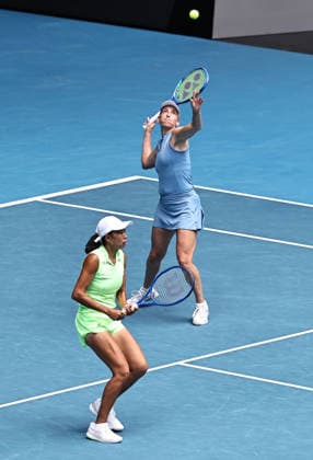 Zhang Shuai (yellow), CHN, and Elise Mertens (blue), BEL, during womens doubles finals at 2026 Australian Open in Melbourne, 31 01 2026; -