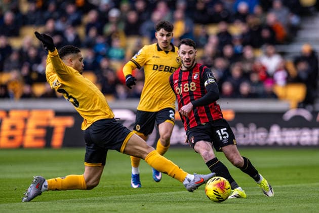 31st January 2026; Molineux Stadium, Wolverhampton, West Midlands, England; Premier League Football, Wolverhampton Wanderers versus Bournemouth; Adam Smith of AFC Bournemouth passes the ball past Joao Gomes of Wolverhampton Wanderers  GodfreyxPitt Content restricted for UK based newspaper