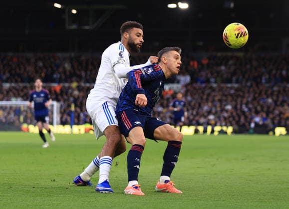 Leeds, England, 31st January 2026. Jayden Bogle of Leeds United (l) tussles with Leandro Trossard of Arsenal (r) during the Leeds United vs Arsenal Premier League match at Elland Road, Leeds. Picture credit should read: Jessica Hornby Sportimage EDITORIAL USE ONLY. No use with unauthorised audio, video, data, fixture lists, club league logos or live services. Online in-match use limited to 120 images, no video emulation. No use in betting, games or single club league player publications. SPI_043_JH_LEEDS_ARSENAL SPI-4494-0040