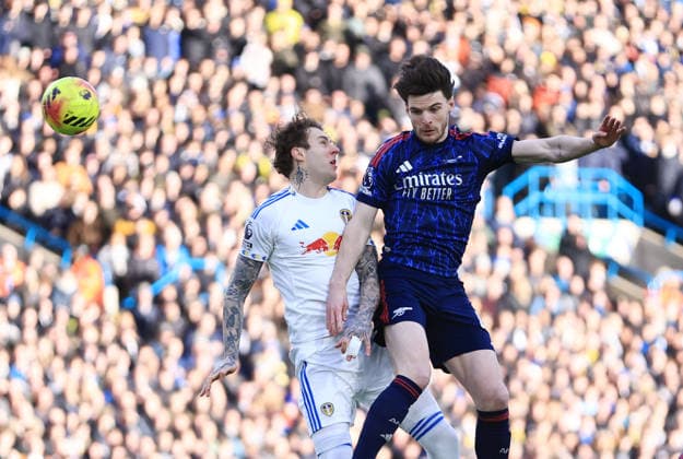 Leeds, England, 31st January 2026. Joe Rodon of Leeds United and Declan Rice of Arsenal during the Leeds United vs Arsenal Premier League match at Elland Road, Leeds. Picture credit should read: Jessica Hornby Sportimage EDITORIAL USE ONLY. No use with unauthorised audio, video, data, fixture lists, club league logos or live services. Online in-match use limited to 120 images, no video emulation. No use in betting, games or single club league player publications. SPI_039_JH_LEEDS_ARSENAL SPI-4494-0043