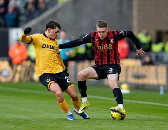 Wolverhampton, England, 31st January 2026. Rodrigo Gomes of Wolverhampton Wanderers tackles Adrien Truffert of Bournemouth during the Wolverhampton Wanderers vs AFC Bournemouth Premier League match at Molineux, Wolverhampton. Picture credit should read: Andrew Yates Sportimage EDITORIAL USE ONLY. No use with unauthorised audio, video, data, fixture lists, club league logos or live services. Online in-match use limited to 120 images, no video emulation. No use in betting, games or single club league player publications. SPI_024_AY_Wolves_Bmouth SPI-4493-0024