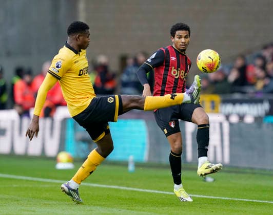 Wolverhampton, England, 31st January 2026. Yerson Mosquera of Wolverhampton Wanderers attempts to block Amine Adli of Bournemouth during the Wolverhampton Wanderers vs AFC Bournemouth Premier League match at Molineux, Wolverhampton. Picture credit should read: Andrew Yates Sportimage EDITORIAL USE ONLY. No use with unauthorised audio, video, data, fixture lists, club league logos or live services. Online in-match use limited to 120 images, no video emulation. No use in betting, games or single club league player publications. SPI_030_AY_Wolves_Bmouth SPI-4493-0028