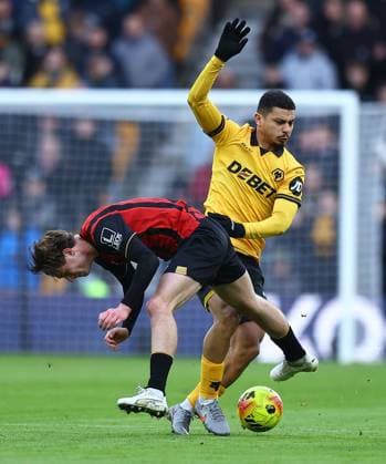 Andre of Wolverhampton Wanderers competes for the ball with Alex Scott of AFC Bournemouth Wolverhampton Wanderers v AFC Bournemouth, Premier League, Football, Molineux, Wolverhampton, UK - 31 Jan 2026Wolverhampton Molineux United Kingdom EDITORIAL USE ONLY No use with unauthorised audio, video, data, fixture lists, club league logos or live services. Online in-match use limited to 120 images, no video emulation. No use in betting, games or single club league player publications. Copyright: xMichaelxZemanek Shutterstockx 16496747u