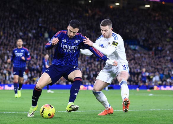 Leeds, England, 31st January 2026. Gabriel Martinelli of Arsenal tussles with Gabriel Gudmundsson of Leeds United during the Leeds United vs Arsenal Premier League match at Elland Road, Leeds. Picture credit should read: Jessica Hornby Sportimage EDITORIAL USE ONLY. No use with unauthorised audio, video, data, fixture lists, club league logos or live services. Online in-match use limited to 120 images, no video emulation. No use in betting, games or single club league player publications. SPI_068_JH_LEEDS_ARSENAL SPI-4494-0071