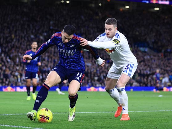Leeds, England, 31st January 2026. Gabriel Martinelli of Arsenal tussles with Gabriel Gudmundsson of Leeds United during the Leeds United vs Arsenal Premier League match at Elland Road, Leeds. Picture credit should read: Jessica Hornby Sportimage EDITORIAL USE ONLY. No use with unauthorised audio, video, data, fixture lists, club league logos or live services. Online in-match use limited to 120 images, no video emulation. No use in betting, games or single club league player publications. SPI_069_JH_LEEDS_ARSENAL SPI-4494-0072
