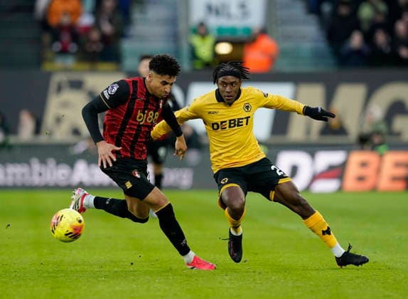 Wolverhampton, England, 31st January 2026. James Hill of Bournemouth and Jean-Ricner Bellegarde of Wolverhampton Wanderers during the Wolverhampton Wanderers vs AFC Bournemouth Premier League match at Molineux, Wolverhampton. Picture credit should read: Andrew Yates Sportimage EDITORIAL USE ONLY. No use with unauthorised audio, video, data, fixture lists, club league logos or live services. Online in-match use limited to 120 images, no video emulation. No use in betting, games or single club league player publications. SPI_048_AY_Wolves_Bmouth SPI-4493-0046