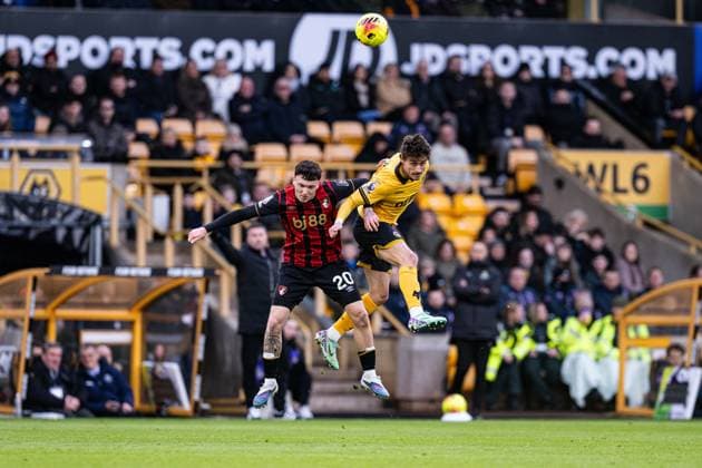 31st January 2026; Molineux Stadium, Wolverhampton, West Midlands, England; Premier League Football, Wolverhampton Wanderers versus Bournemouth; Hugo Bueno of Wolverhampton Wanderers wins an aerial duel with Alex Jimenez of AFC Bournemouth  GodfreyxPitt Content restricted for UK based newspaper