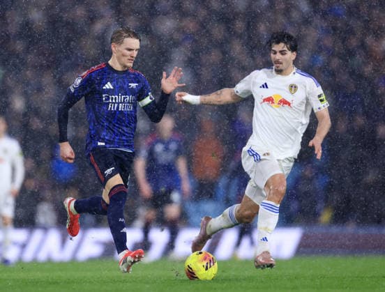 Leeds, England, 31st January 2026. Martin Odegaard of Arsenal and Pascal Struijk of Leeds United during the Leeds United vs Arsenal Premier League match at Elland Road, Leeds. Picture credit should read: Jessica Hornby Sportimage EDITORIAL USE ONLY. No use with unauthorised audio, video, data, fixture lists, club league logos or live services. Online in-match use limited to 120 images, no video emulation. No use in betting, games or single club league player publications. SPI_074_JH_LEEDS_ARSENAL SPI-4494-0077