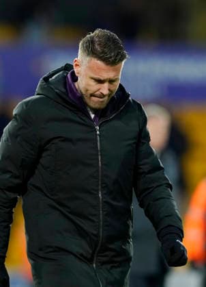 Wolverhampton, England, 31st January 2026. Dejected Rob Edwards manager of Wolverhampton Wanderers claps the fans during the Wolverhampton Wanderers vs AFC Bournemouth Premier League match at Molineux, Wolverhampton. Picture credit should read: Andrew Yates Sportimage EDITORIAL USE ONLY. No use with unauthorised audio, video, data, fixture lists, club league logos or live services. Online in-match use limited to 120 images, no video emulation. No use in betting, games or single club league player publications. SPI_058_AY_Wolves_Bmouth SPI-4493-0056