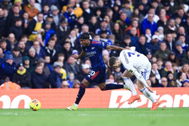 Leeds, England, 31st January 2026. Noni Madueke of Arsenal runs with the ball whilst under pressure from Gabriel Gudmundsson of Leeds United during the Leeds United vs Arsenal Premier League match at Elland Road, Leeds. Picture credit should read: Jessica Hornby Sportimage EDITORIAL USE ONLY. No use with unauthorised audio, video, data, fixture lists, club league logos or live services. Online in-match use limited to 120 images, no video emulation. No use in betting, games or single club league player publications. SPI_101_JH_LEEDS_ARSENAL SPI-4494-0104