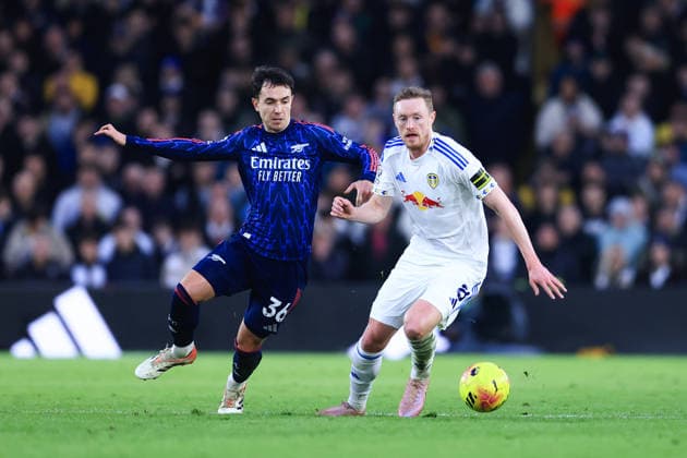 Leeds, England, 31st January 2026. Sean Longstaff of Leeds United is challenged by Martin Zubimendi of Arsenal during the Leeds United vs Arsenal Premier League match at Elland Road, Leeds. Picture credit should read: Jessica Hornby Sportimage EDITORIAL USE ONLY. No use with unauthorised audio, video, data, fixture lists, club league logos or live services. Online in-match use limited to 120 images, no video emulation. No use in betting, games or single club league player publications. SPI_104_JH_LEEDS_ARSENAL SPI-4494-0107