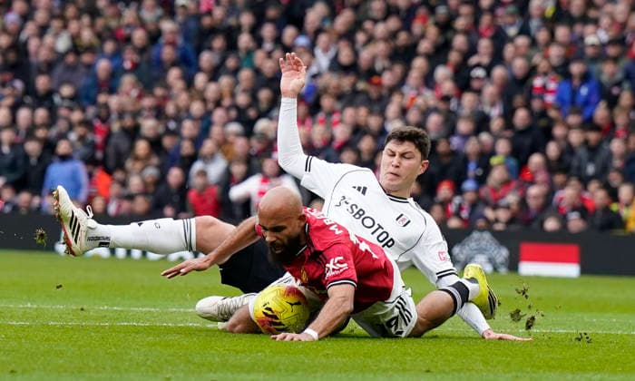 Manchester, England, 1st February 2026. Bryan Mbeumo of Manchester United, ManU is challenged by Jorge Cuenca of Fulham (R) during the Manchester United vs Fulham Premier League match at Old Trafford, Manchester. Picture credit should read: Andrew Yates Sportimage EDITORIAL USE ONLY. No use with unauthorised audio, video, data, fixture lists, club league logos or live services. Online in-match use limited to 120 images, no video emulation. No use in betting, games or single club league player publications. SPI_025_AY_MAN_UTD_FULHAM SPI-4502-0024