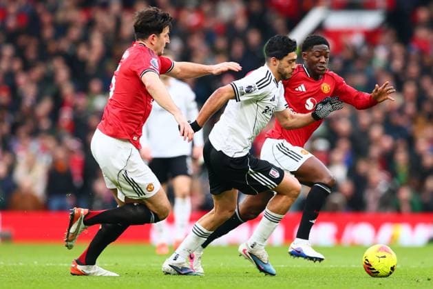 Harry Maguire of Manchester United, ManU and Raul Jimenez of Fulham Manchester United v Fulham, Premier League, Football, Old Trafford, Manchester, UK - 01 Feb 2026Manchester Old Trafford United Kingdom EDITORIAL USE ONLY No use with unauthorised audio, video, data, fixture lists, club league logos or live services. Online in-match use limited to 120 images, no video emulation. No use in betting, games or single club league player publications. Copyright: xPaulxCurrie Shutterstockx 16496861dr