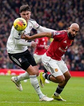 Manchester, England, 1st February 2026. Jorge Cuenca of Fulham (L) challenges Bryan Mbeumo of Manchester United, ManU during the Manchester United vs Fulham Premier League match at Old Trafford, Manchester. Picture credit should read: Andrew Yates Sportimage EDITORIAL USE ONLY. No use with unauthorised audio, video, data, fixture lists, club league logos or live services. Online in-match use limited to 120 images, no video emulation. No use in betting, games or single club league player publications. SPI_031_AY_MAN_UTD_FULHAM SPI-4502-0030
