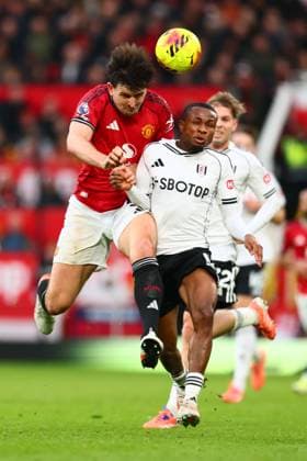 Harry Maguire of Manchester United, ManU and Samuel Chukwueze of Fulham Manchester United v Fulham, Premier League, Football, Old Trafford, Manchester, UK - 01 Feb 2026Manchester Old Trafford United Kingdom EDITORIAL USE ONLY No use with unauthorised audio, video, data, fixture lists, club league logos or live services. Online in-match use limited to 120 images, no video emulation. No use in betting, games or single club league player publications. Copyright: xPaulxCurrie Shutterstockx 16496861eh