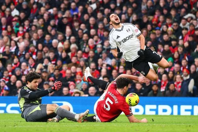 Raul Jimenez of Fulham is fouled by Harry Maguire of Manchester United, ManU for a penalty Manchester United v Fulham, Premier League, Football, Old Trafford, Manchester, UK - 01 Feb 2026Manchester Old Trafford United Kingdom EDITORIAL USE ONLY No use with unauthorised audio, video, data, fixture lists, club league logos or live services. Online in-match use limited to 120 images, no video emulation. No use in betting, games or single club league player publications.  Copyright: xPaulxCurrie Shutterstockx 16496861gm