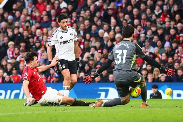 Raul Jimenez of Fulham is fouled by Harry Maguire of Manchester United, ManU for a penalty Manchester United v Fulham, Premier League, Football, Old Trafford, Manchester, UK - 01 Feb 2026Manchester Old Trafford United Kingdom EDITORIAL USE ONLY No use with unauthorised audio, video, data, fixture lists, club league logos or live services. Online in-match use limited to 120 images, no video emulation. No use in betting, games or single club league player publications.  Copyright: xPaulxCurrie Shutterstockx 16496861go