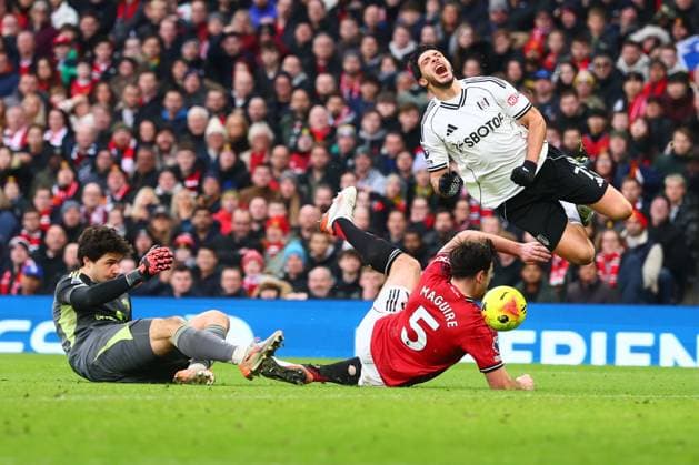 Raul Jimenez of Fulham is fouled by Harry Maguire of Manchester United, ManU for a penalty Manchester United v Fulham, Premier League, Football, Old Trafford, Manchester, UK - 01 Feb 2026Manchester Old Trafford United Kingdom EDITORIAL USE ONLY No use with unauthorised audio, video, data, fixture lists, club league logos or live services. Online in-match use limited to 120 images, no video emulation. No use in betting, games or single club league player publications.  Copyright: xPaulxCurrie Shutterstockx 16496861gq