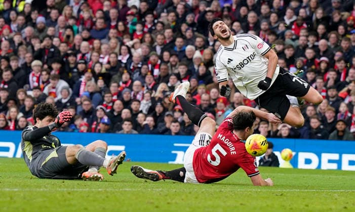Manchester, England, 1st February 2026. Raul Jimenez of Fulham (up) is fouled for a penalty during the Manchester United, ManU vs Fulham Premier League match at Old Trafford, Manchester. Picture credit should read: Andrew Yates Sportimage EDITORIAL USE ONLY. No use with unauthorised audio, video, data, fixture lists, club league logos or live services. Online in-match use limited to 120 images, no video emulation. No use in betting, games or single club league player publications. SPI_036_AY_MAN_UTD_FULHAM SPI-4502-0035