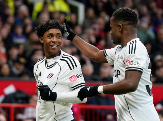 Manchester, England, 1st February 2026. Kevin of Fulham (L) celebrates after scoring with Ryan Sessegnon of Fulham during the Manchester United, ManU vs Fulham Premier League match at Old Trafford, Manchester. Picture credit should read: Andrew Yates Sportimage EDITORIAL USE ONLY. No use with unauthorised audio, video, data, fixture lists, club league logos or live services. Online in-match use limited to 120 images, no video emulation. No use in betting, games or single club league player publications. SPI_040_AY_MAN_UTD_FULHAM SPI-4502-0039