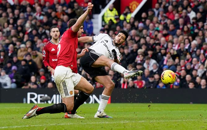 Manchester, England, 1st February 2026. Raul Jimenez of Fulham (R) shoots during the Manchester United, ManU vs Fulham Premier League match at Old Trafford, Manchester. Picture credit should read: Andrew Yates Sportimage EDITORIAL USE ONLY. No use with unauthorised audio, video, data, fixture lists, club league logos or live services. Online in-match use limited to 120 images, no video emulation. No use in betting, games or single club league player publications. SPI_044_AY_MAN_UTD_FULHAM SPI-4502-0043