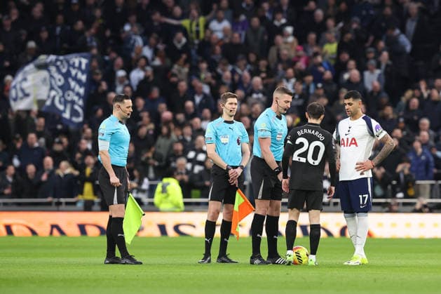 1st February 2026; Tottenham Hotspur Stadium, London, England; Premier League Football, Tottenham Hotspur versus Manchester City; referee Robert Jones and Tottenham Hotspur captain Cristian Romero and Manchester City captain Bernardo Silva during the pre-match coin toss  KatiexChan Content restricted for UK based newspaper