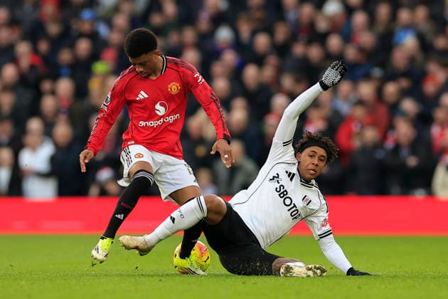 Manchester United, ManU v Fulham, Premier League Kevin (22) of Fulham and Amad Diallo (16) of Manchester United challenge for the ball during the Premier League match between Manchester United and Fulham at Old Trafford, Manchester, UK on 1 February 2026. Manchester Old Trafford Greater Manchester UK Editorial use only DataCo restrictions apply See www.football-dataco.com , Copyright: xConorxMolloyx PSI-23668-0130