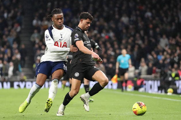 1st February 2026; Tottenham Hotspur Stadium, London, England; Premier League Football, Tottenham Hotspur versus Manchester City; Matheus Nunes of Manchester City is pulled back in a foul by Destiny Udogie of Tottenham Hotspur  KatiexChan Content restricted for UK based newspaper