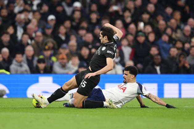 1st February 2026; Tottenham Hotspur Stadium, London, England; Premier League Football, Tottenham Hotspur versus Manchester City; Abdukodir Khusanov of Manchester City and Dominic Solanke of Tottenham Hotspur slide for the ball  KatiexChan Content restricted for UK based newspaper