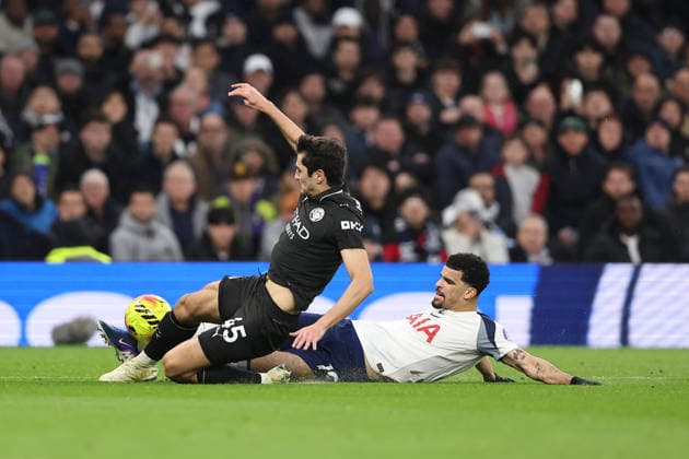 1st February 2026; Tottenham Hotspur Stadium, London, England; Premier League Football, Tottenham Hotspur versus Manchester City; Abdukodir Khusanov of Manchester City and Dominic Solanke of Tottenham Hotspur slide for the ball  KatiexChan Content restricted for UK based newspaper