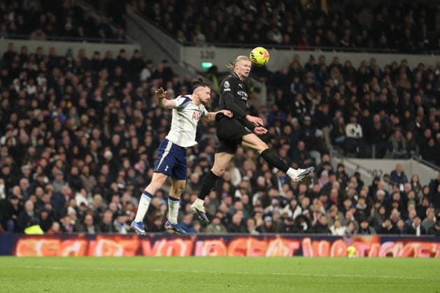 1st February 2026; Tottenham Hotspur Stadium, London, England; Premier League Football, Tottenham Hotspur versus Manchester City; Erling Haaland of Manchester City wins the header above Radu Dragusin of Tottenham Hotspur  KatiexChan Content restricted for UK based newspaper