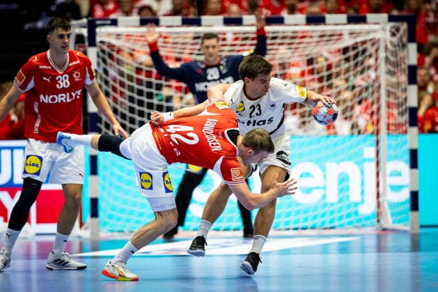 HERNING, DENMARK - FEBRUARY 1: Renars Uscins (Germany, 23) against Thomas Sommer Arnoldsson (Denmark, 42) during the EHF EURO 2026 Final match between Denmark vs Germany at Jyske Bank Boxen Arena on February 1, 2026 in Herning, Denmark. Midtjylland Denmark Copyright: xMarioxM.xKobergx