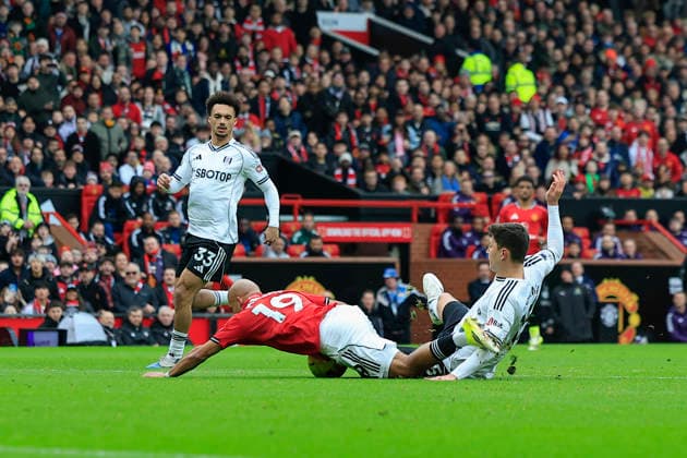 Manchester United, ManU v Fulham, Premier League Bryan Mbeumo (19) of Manchester United goes down under challenge from Jorge Cuenca (15) of Fulham but no penalty is given during the Premier League match between Manchester United and Fulham at Old Trafford, Manchester, UK on 1 February 2026. Manchester Old Trafford Greater Manchester UK Editorial use only DataCo restrictions apply See www.football-dataco.com , Copyright: xConorxMolloyx PSI-23668-0145