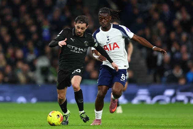 London, England, 1st February 2026. Bernardo Silva of Manchester City and Yves Bissouma of Tottenham Hotspur challenge for the ball during the Tottenham Hotspur vs Manchester City Premier League match at the Tottenham Hotspur Stadium, London. Picture credit should read: Paul Terry Sportimage EDITORIAL USE ONLY. No use with unauthorised audio, video, data, fixture lists, club league logos or live services. Online in-match use limited to 120 images, no video emulation. No use in betting, games or single club league player publications. SPI_071_PT_Tottenham_Man_City SPI-4504-0071