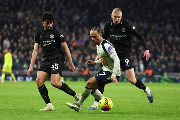 London, England, 1st February 2026. Xavi Simons of Tottenham Hotspur under pressure form Abdukodir Khusanov (L) and Erling Haaland of Manchester City during the Tottenham Hotspur vs Manchester City Premier League match at the Tottenham Hotspur Stadium, London. Picture credit should read: Paul Terry Sportimage EDITORIAL USE ONLY. No use with unauthorised audio, video, data, fixture lists, club league logos or live services. Online in-match use limited to 120 images, no video emulation. No use in betting, games or single club league player publications. SPI_079_PT_Tottenham_Man_City SPI-4504-0079