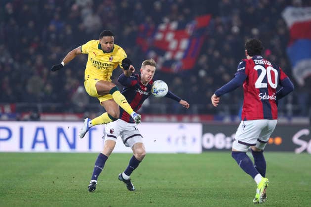 Christopher Nkunku of AC Milan and Jens Odgaard of Bologna FC compete for the ball during the serie A match between Bologna FC and AC Milan at Renato dall™Ara stadium in Bologna (Italy), February 3, 2026. massimilianoxcarnabuci