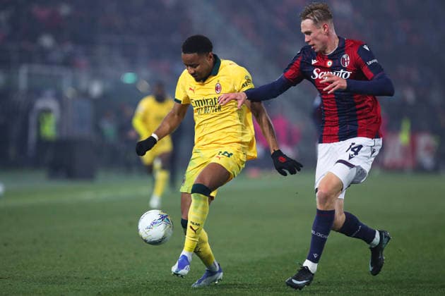 Christopher Nkunku of AC Milan and Torbjorn Heggem of Bologna FC compete for the ball during the serie A match between Bologna FC and AC Milan at Renato dall™Ara stadium in Bologna (Italy), February 3, 2026. massimilianoxcarnabuci