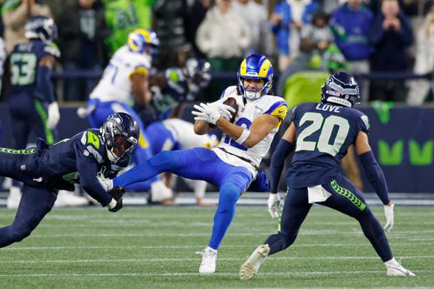 SEATTLE, WA - JANUARY 25: Ernest Jones 13 and Julian Love 20 of the Seattle Seahawks tackle Puka Nacua 12 of the Los Angeles Rams during the NFC Championship on January 25, 2026 at Lumen Field in Seattle, Washington. (Photo by Joe Robbins Image of Seattle WA United States EDITORIAL USE ONLY Copyright: xJoexRobbinsx JoexRobbins ImagexofxSportx iosphotos393671