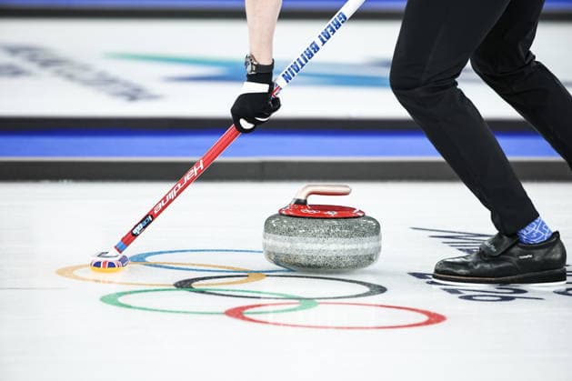 ITALY, CORTINA D AMPEZZO - FEBRUARY 4, 2026: A curler is in action in the Mixed Doubles Round Robin Session 1 curling event during the 2026 Winter Olympic Games, Olympische Spiele, Olympia, OS at the Cortina Curling Olympic Stadium. Mikhail Tereshchenko TASS  88208482