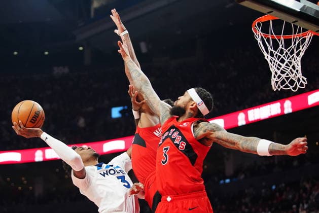 February 4, 2026, Toronto, On, CANADA: Minnesota Timberwolves Jaden McDaniels (3) is fouled by Toronto Raptors Collin Murray-Boyles (centre back) as Brandon Ingram (3) defends during first half NBA, Basketball Herren, USA basketball action in Toronto on Wednesday, Feb. 4, 2026. Canada News - February 4, 2026  - ZUMAc35_ 20260204_zaf_c35_126 Copyright: xFrankxGunnx