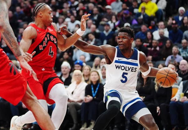 February 4, 2026, Toronto, On, CANADA: Minnesota Timberwolves Anthony Edwards (5) protects the ball from Toronto Raptors Scottie Barnes (4) during first half NBA, Basketball Herren, USA basketball action in Toronto on Wednesday, Feb. 4, 2026. Canada News - February 4, 2026  - ZUMAc35_ 20260204_zaf_c35_128 Copyright: xFrankxGunnx