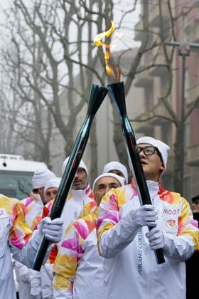 Milan Cortina Olympics: Torch relay Torch relay runners transfer the Olympic flame in Milan on Feb. 5, 2026, ahead of the upcoming Milan Cortina Olympics.  A14AA0005246517P