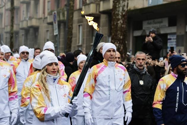 Milan Cortina Olympics: Torch relay A runner carries the Olympic flame during the Milan Cortina Olympics torch relay in Milan on Feb. 5, 2026.  A14AA0005246531P